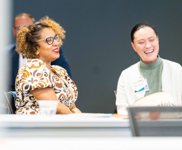 Two people laughing and smiling