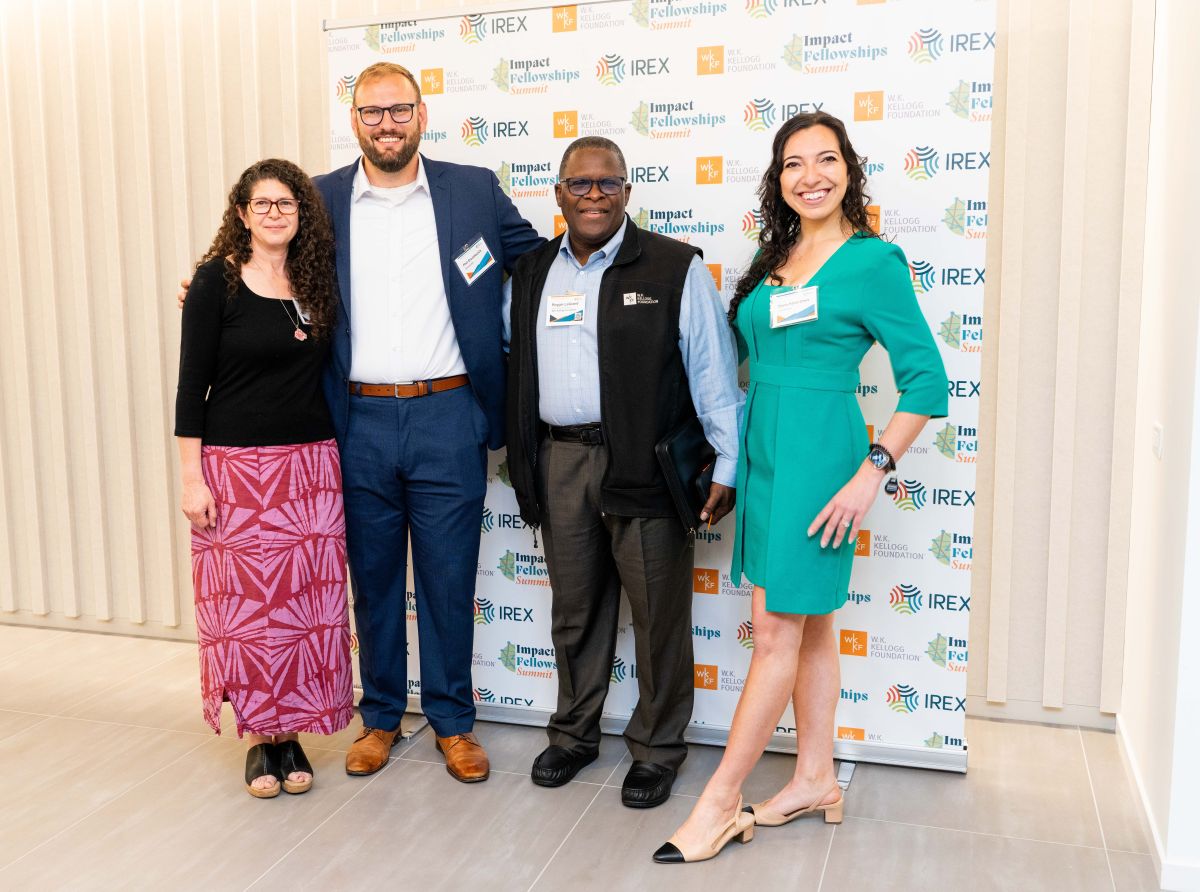 Four people posing for a photo