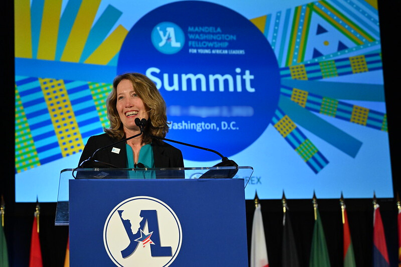 Image of Kristin Lord speaking at a podium during the Mandela Washington Fellowship Summit